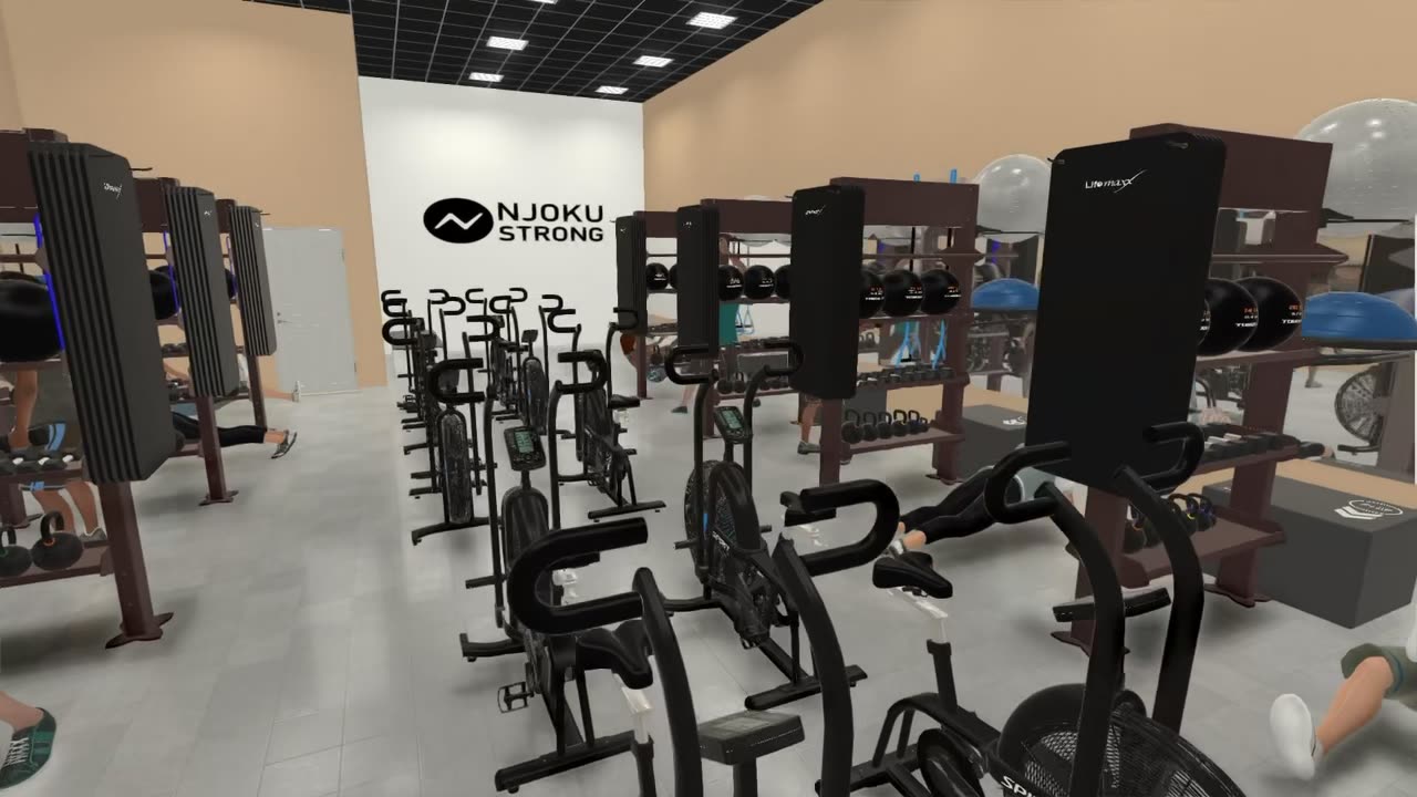 A frame from the Njoku Strong architectural design walkthrough: the training floor layout with bikes, benches, and the studio logo wall.